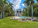 Charming waterfront home with pool and lush tropical landscaping at 4521 Bay Shore Rd, Sarasota, FL 34234