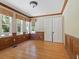 Spacious office with hardwood floors and wood paneled walls at 4521 Bay Shore Rd, Sarasota, FL 34234