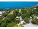 Aerial view of waterfront property with lush landscaping at 4521 Bay Shore Rd, Sarasota, FL 34234