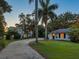 Gravel driveway leading to charming, well-lit home at 4521 Bay Shore Rd, Sarasota, FL 34234