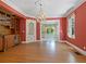 Formal dining room with hardwood floors, built-in cabinetry, and a charming chandelier at 4521 Bay Shore Rd, Sarasota, FL 34234
