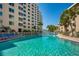 Refreshing pool with plenty of lounge chairs for relaxation at 5920 Midnight Pass Rd # 104, Sarasota, FL 34242