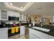 Modern kitchen with granite counters, stainless steel appliances, and white cabinets at 5920 Midnight Pass Rd # 104, Sarasota, FL 34242