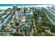 Aerial view showing resort amenities including tennis courts and pool at 5920 Midnight Pass Rd # 104, Sarasota, FL 34242