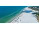 Aerial view of expansive beach with clear water at 5920 Midnight Pass Rd # 104, Sarasota, FL 34242