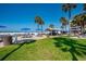 Outdoor BBQ area and seating with beach views at 5920 Midnight Pass Rd # 104, Sarasota, FL 34242