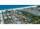 Aerial view of beach resort community with tennis courts and oceanfront location at 5920 Midnight Pass Rd # 104, Sarasota, FL 34242