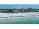 Aerial view showcasing oceanfront resort building and beach access at 5920 Midnight Pass Rd # 104, Sarasota, FL 34242