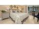 Comfortable bedroom with a king-size bed and access to a balcony at 5920 Midnight Pass Rd # 104, Sarasota, FL 34242