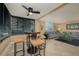 Casual dining area with glass table and four chairs, near the living room at 5920 Midnight Pass Rd # 104, Sarasota, FL 34242