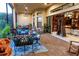 Evening view of a spacious screened patio furnished with comfortable seating at 5309 Greenbrook Dr, Sarasota, FL 34238