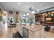 Open kitchen with large island, stainless steel appliances, and a view of dining and living area at 5309 Greenbrook Dr, Sarasota, FL 34238