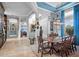 Elegant dining room featuring a large wooden table and blue accents at 5309 Greenbrook Dr, Sarasota, FL 34238