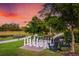 Giant chessboard and Adirondack chairs in a scenic community park at 5309 Greenbrook Dr, Sarasota, FL 34238