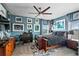 Primary bedroom with built-in bookshelves and a ceiling fan at 5309 Greenbrook Dr, Sarasota, FL 34238