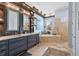 Elegant bathroom with double vanity, soaking tub, and walk-in shower at 5309 Greenbrook Dr, Sarasota, FL 34238