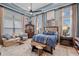 Main bedroom with sitting area and large windows at 5309 Greenbrook Dr, Sarasota, FL 34238