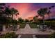 Bocce ball court with seating area under a beautiful sunset at 5309 Greenbrook Dr, Sarasota, FL 34238