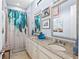 Guest bathroom with double vanity and shower/tub combo at 5309 Greenbrook Dr, Sarasota, FL 34238