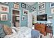 Primary bedroom with ensuite bathroom and a wall of framed artwork at 5309 Greenbrook Dr, Sarasota, FL 34238