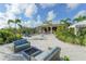 Relaxing fire pit with comfortable seating in a sandy area at 5309 Greenbrook Dr, Sarasota, FL 34238
