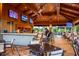 Indoor bar with TVs showing sports, comfortable seating at 5309 Greenbrook Dr, Sarasota, FL 34238