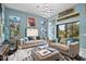 Bright living room with two sofas, a large rug, and a modern chandelier at 5309 Greenbrook Dr, Sarasota, FL 34238