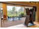 Relaxing screened patio with seating area and view of lush greenery at 5309 Greenbrook Dr, Sarasota, FL 34238