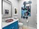 Powder room with unique sink and modern art at 5309 Greenbrook Dr, Sarasota, FL 34238
