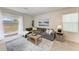 Cozy living room with a comfortable sectional sofa and access to backyard at 3902 Willow Hammock Dr, Palmetto, FL 34221