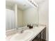 Double vanity bathroom with granite countertops at 3902 Willow Hammock Dr, Palmetto, FL 34221