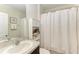 Clean bathroom with a single sink vanity and shower/tub combo at 3902 Willow Hammock Dr, Palmetto, FL 34221