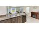 Modern kitchen with granite countertops and stainless steel appliances at 3902 Willow Hammock Dr, Palmetto, FL 34221