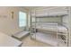 Bedroom with a triple bunk bed and a window seat at 3902 Willow Hammock Dr, Palmetto, FL 34221