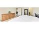 Main bedroom with dresser and ensuite bathroom access at 3902 Willow Hammock Dr, Palmetto, FL 34221
