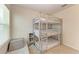 Bedroom with a triple bunk bed and a window seat at 3902 Willow Hammock Dr, Palmetto, FL 34221