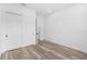 Bedroom with white doors and wood-look flooring at 4593 Targee Ave, North Port, FL 34287