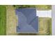 Aerial view of a single Gathering home with a gray roof at 4593 Targee Ave, North Port, FL 34287