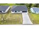 Aerial view of a single-Gathering home with a driveway at 4593 Targee Ave, North Port, FL 34287
