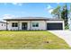 Modern two-bedroom house with a two-car garage at 4593 Targee Ave, North Port, FL 34287