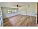 Bedroom featuring light wood floors, ceiling fan, and double closets at 3637 Mineola Dr, Sarasota, FL 34239