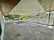 Spacious lanai featuring stone flooring and views of the waterfront at 3637 Mineola Dr, Sarasota, FL 34239