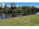 Scenic view of people kayaking along the waterfront, surrounded by lush greenery at 3637 Mineola Dr, Sarasota, FL 34239
