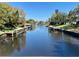 Scenic canal view showcasing docks for boats and access to waterways at 3637 Mineola Dr, Sarasota, FL 34239
