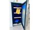 New wine cooler featuring energy guide attached, stainless steel trim, and interior storage rack at 3637 Mineola Dr, Sarasota, FL 34239