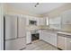 Modern kitchen with stainless steel appliances and white cabinets at 14939 Amberjack Ter # 102, Lakewood Ranch, FL 34202