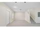 Spacious living area with wood-look floors and stairs at 14939 Amberjack Ter # 102, Lakewood Ranch, FL 34202
