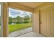 Screened patio overlooking a pond and lush greenery at 14939 Amberjack Ter # 102, Lakewood Ranch, FL 34202