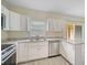Modern kitchen with stainless steel appliances and white cabinets at 14939 Amberjack Ter # 102, Lakewood Ranch, FL 34202