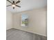 Bright bedroom featuring neutral walls and wood-look floors at 14939 Amberjack Ter # 102, Lakewood Ranch, FL 34202